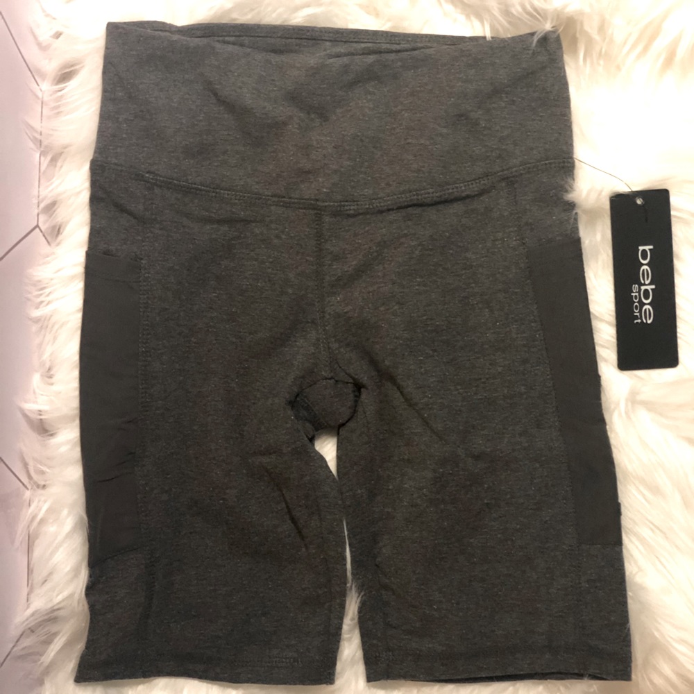 Bebe sport bike shorts with mesh pockets on both sides.   Shorts are size small.